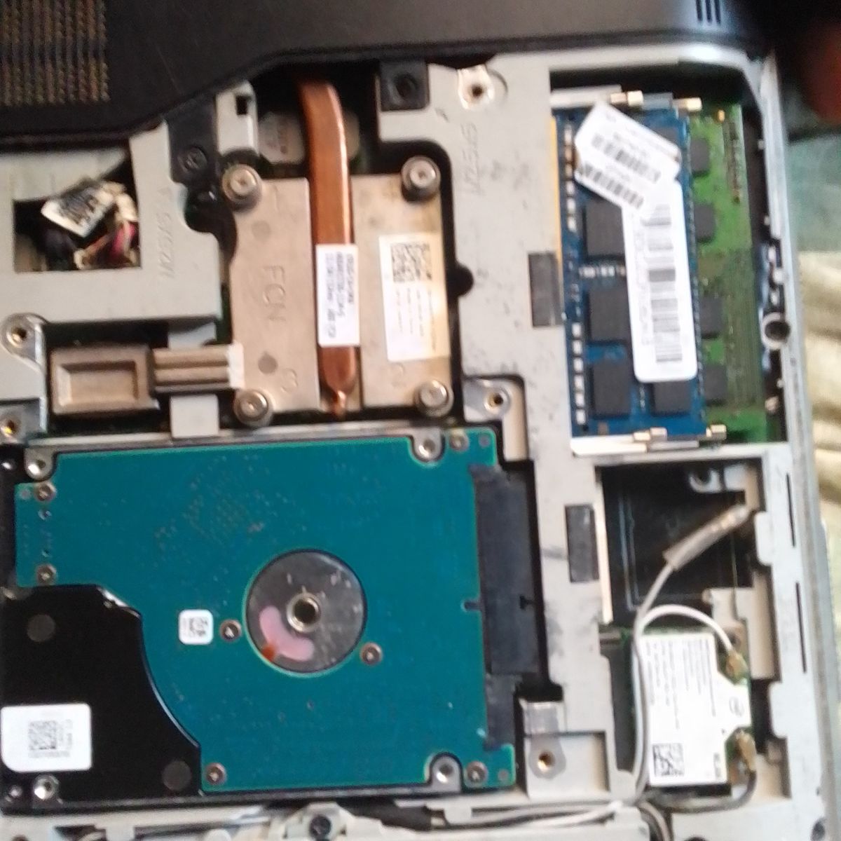Laptop underside with heatsink and hard drive